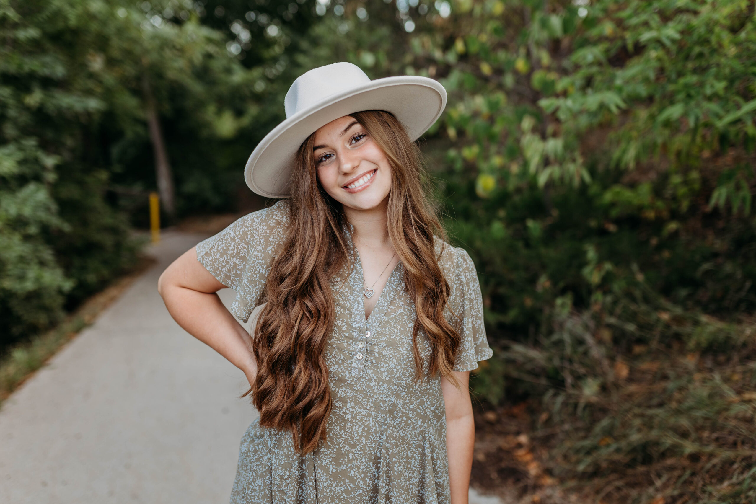 Trendy high school senior girl wearing a hat and dress in nebraska