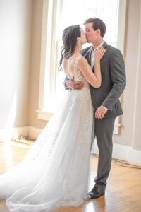 Groom and Bride embracing in a kiss in their Grand Island Wedding Venue 