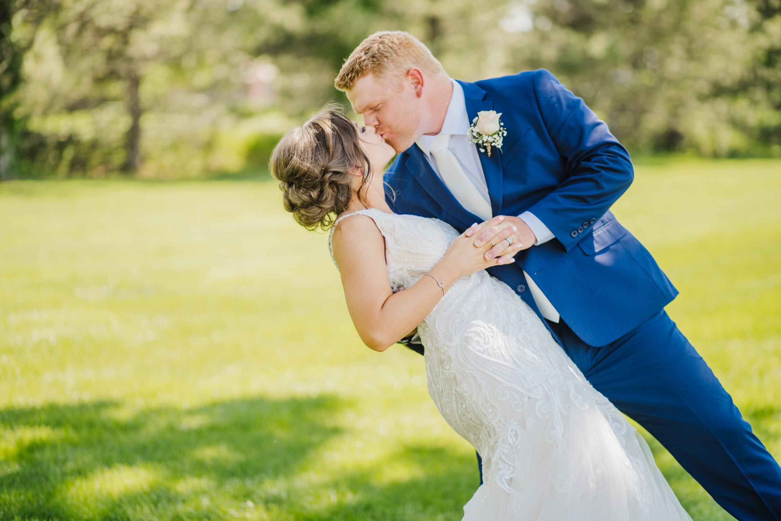 groom and bride kissing while at a grand island wedding venue