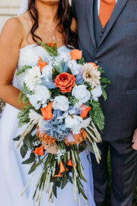floral bouquet in front of the wedding couple